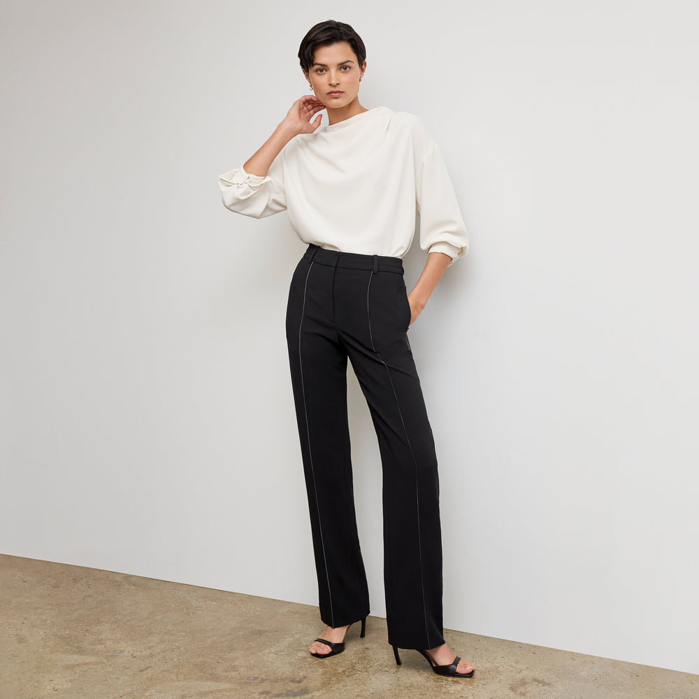 front image of a woman wearing the lowen pant in black with topstitch