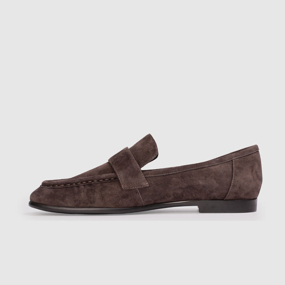 Brown suede loafer on a white background