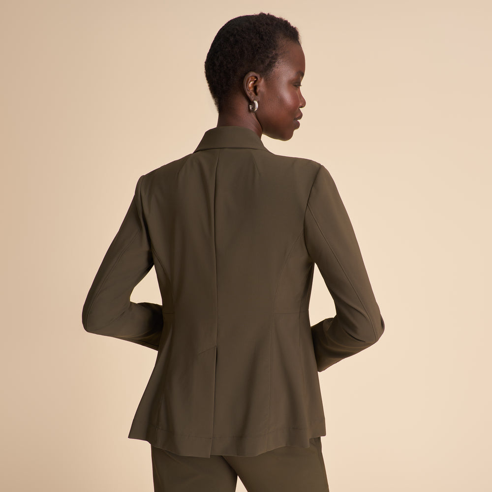 Front image of a woman wearing the Moreland jacket in olive