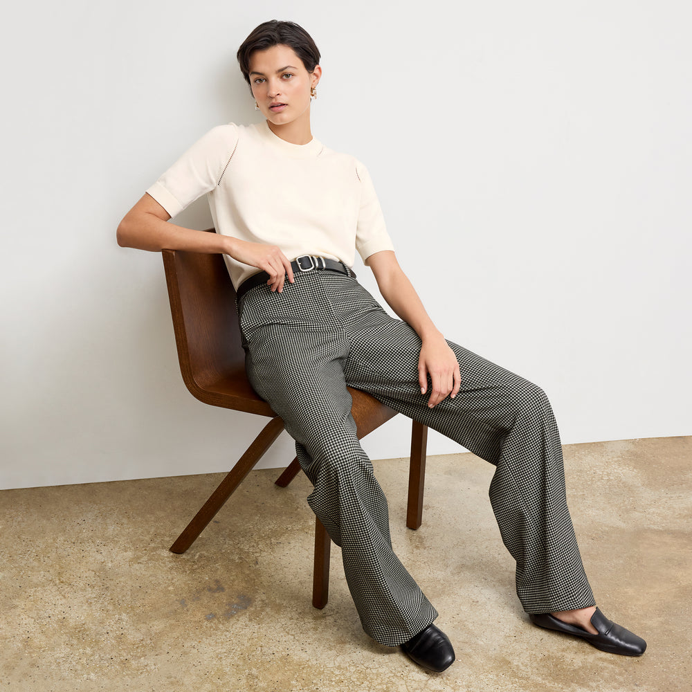 front image of a woman wearing the becca top in ivory