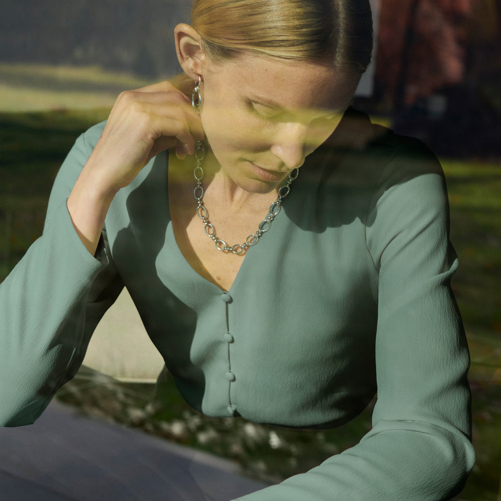 image of a woman wearing the jessel necklace