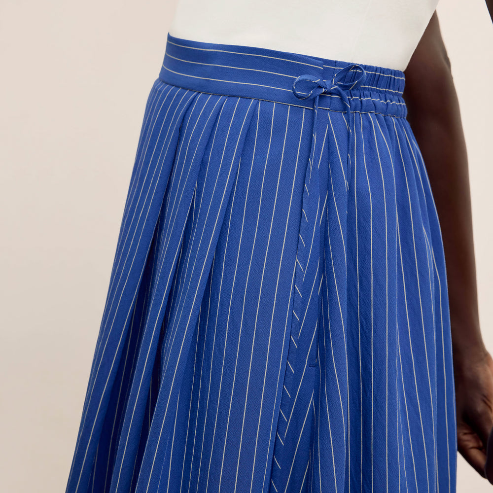 detail image of a woman wearing the easton skirt in soft stripe