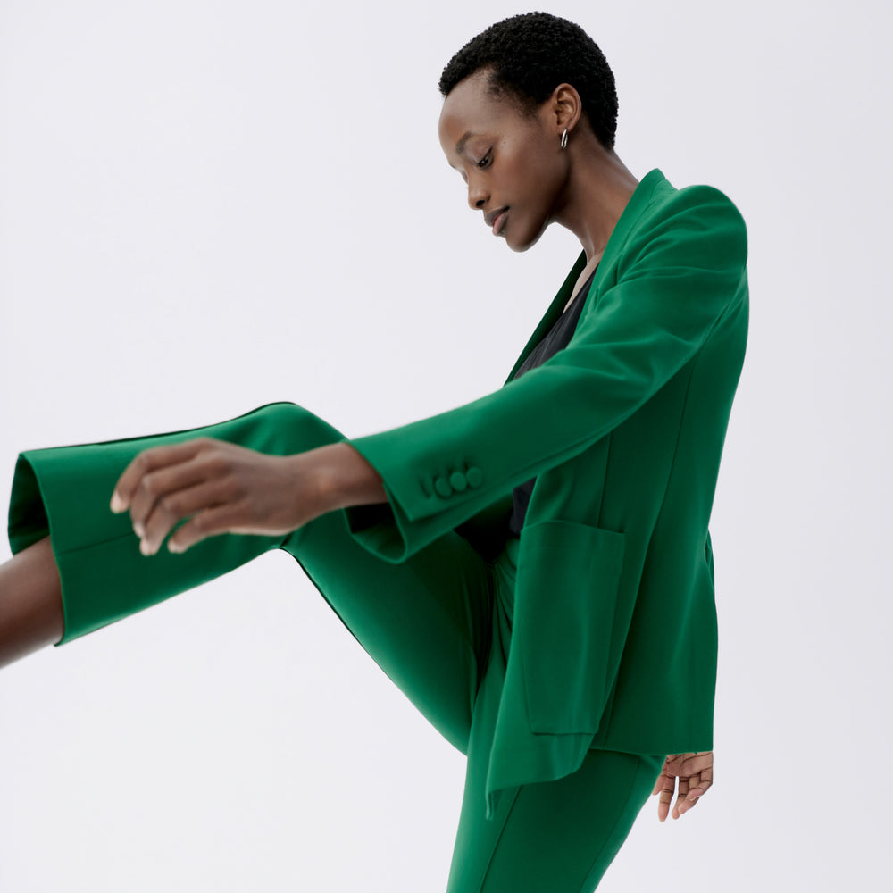 side image of a woman wearing the janette jacket in shamrock