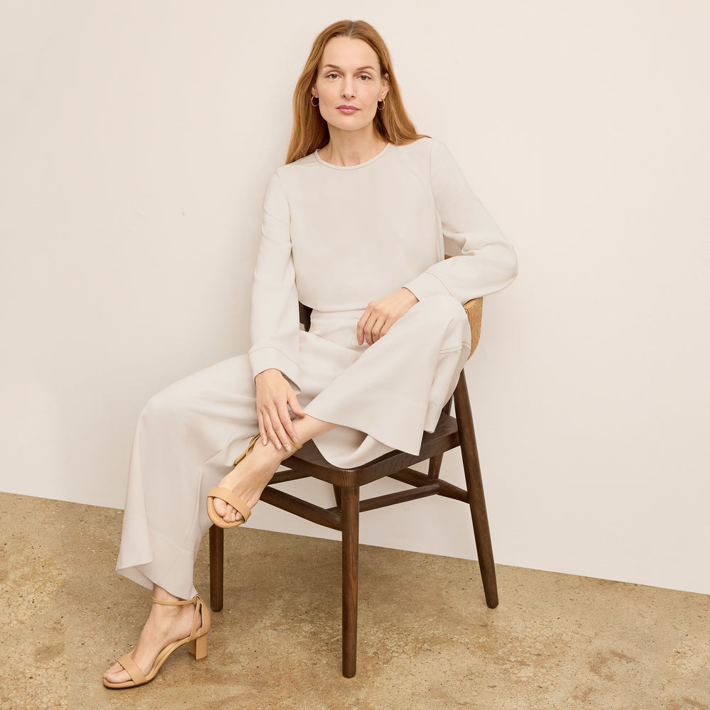 front image of a woman wearing the elena pant in eggshell