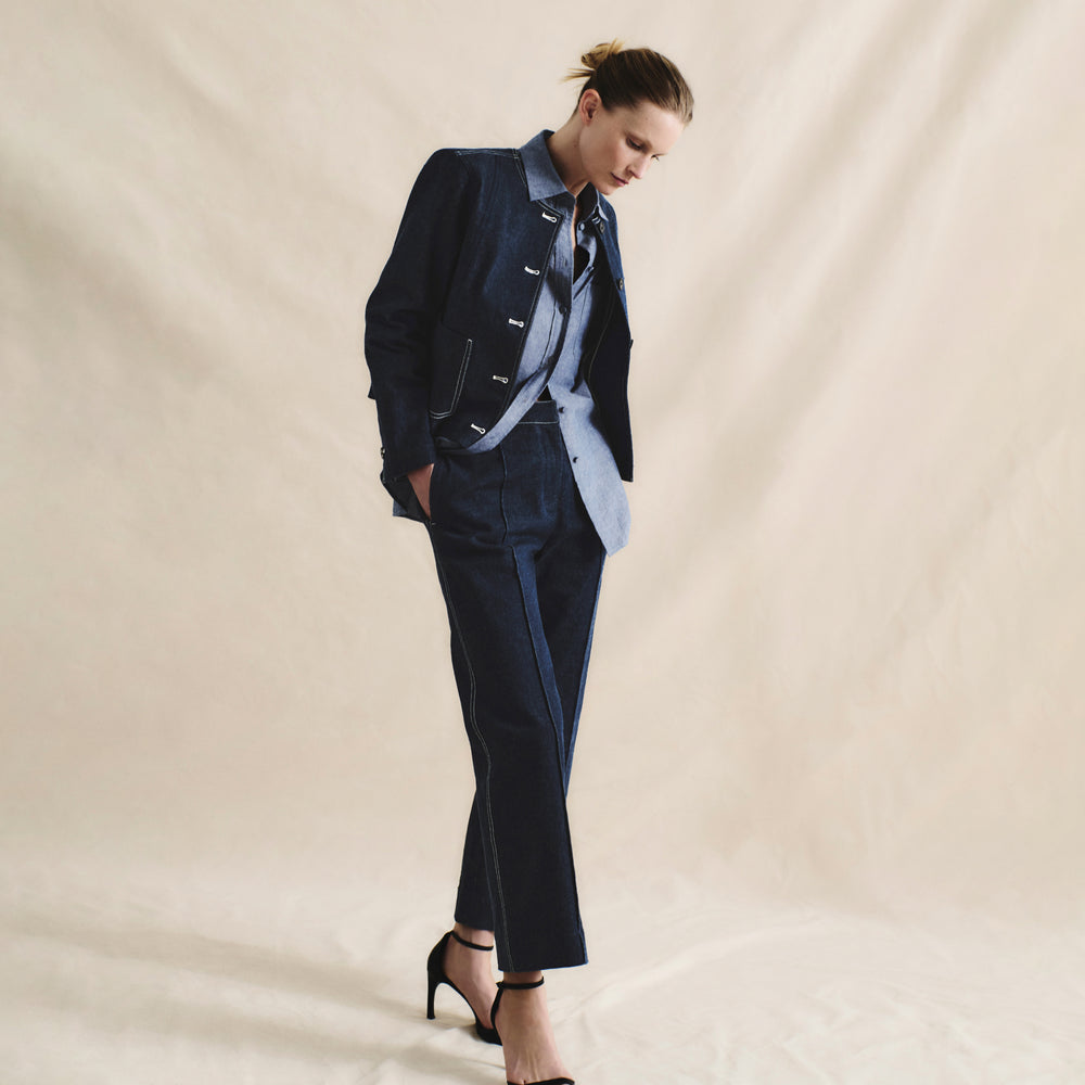 front image of a woman wearing the christy pant in dark wash