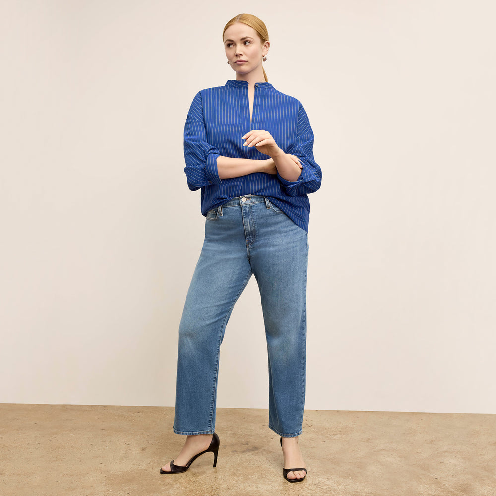 front image of a woman wearing the kylan top in soft stripe