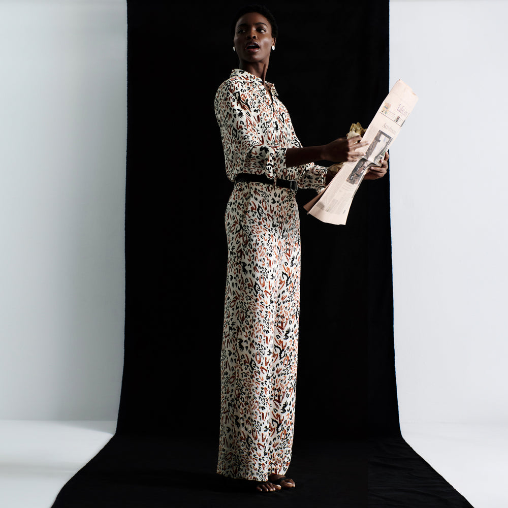 front image of a woman wearing the tinsley trousers in leopard sketch