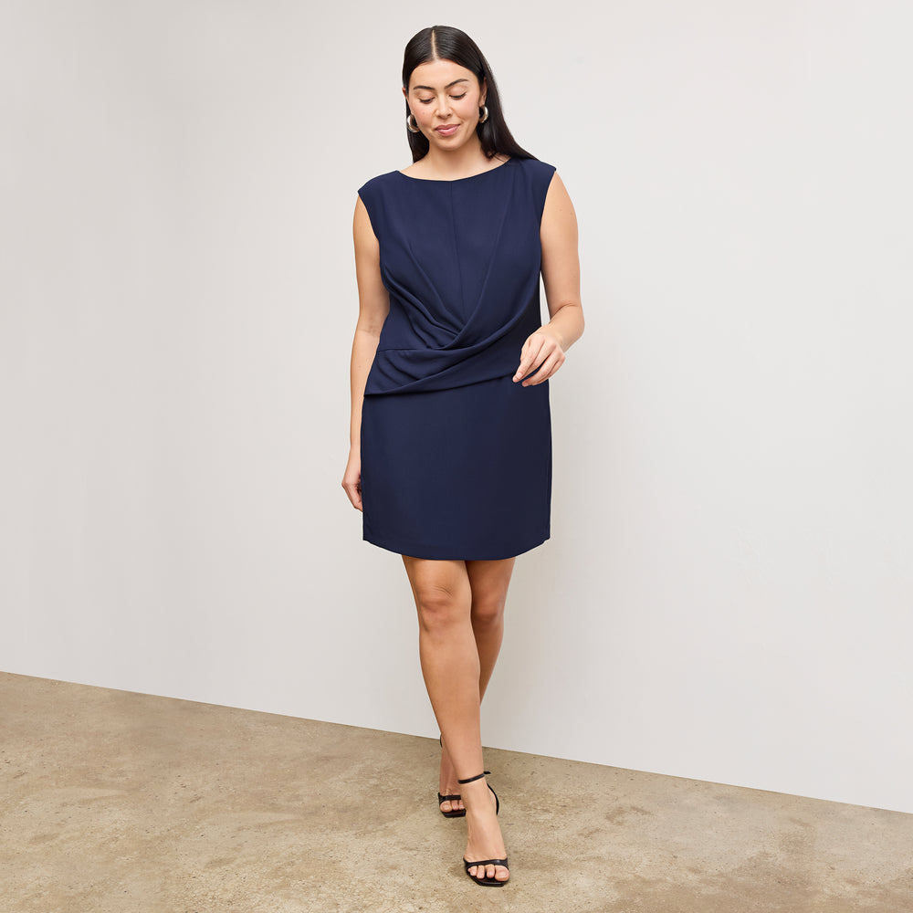 front image of a woman wearing the lynda dress in soft navy