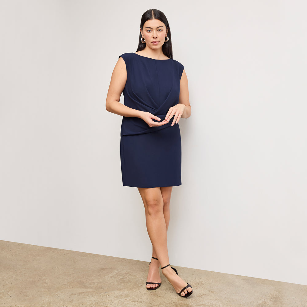 front image of a woman wearing the lynda dress in soft navy