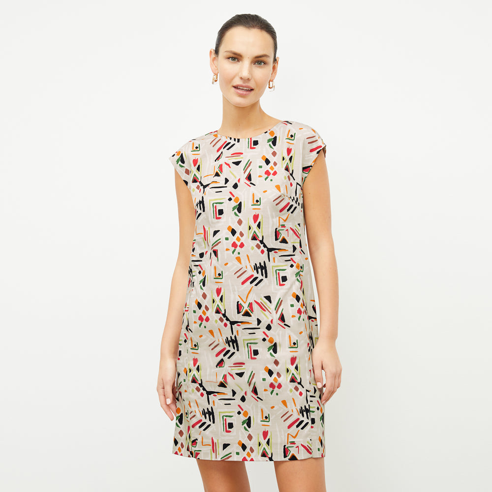 front image of a woman wearing the maaza dress in rhythm print