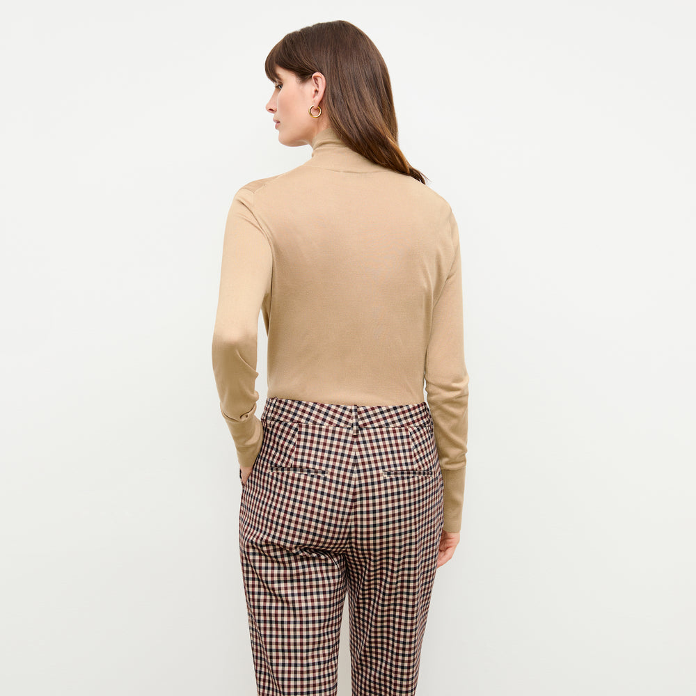 back image of a woman wearing the elizabeth turtleneck in camel