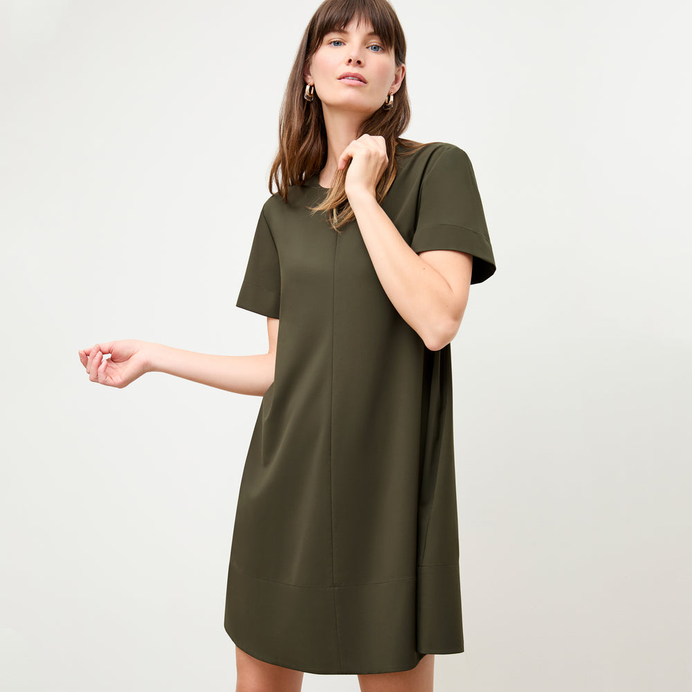 Front image of a woman wearing the Corrie Dress in Olive