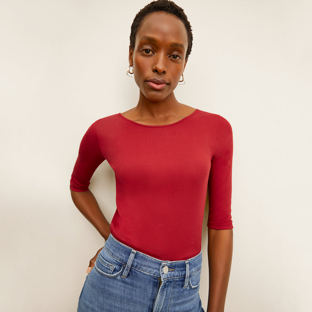 front image of a woman wearing the soyoung t-shirt in cardinal