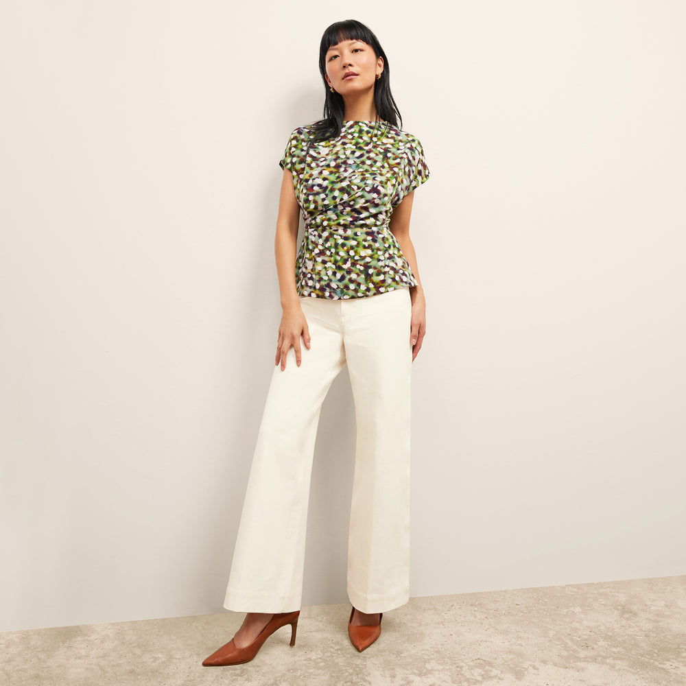 front image of a woman wearing the nejvi top in spotlight print