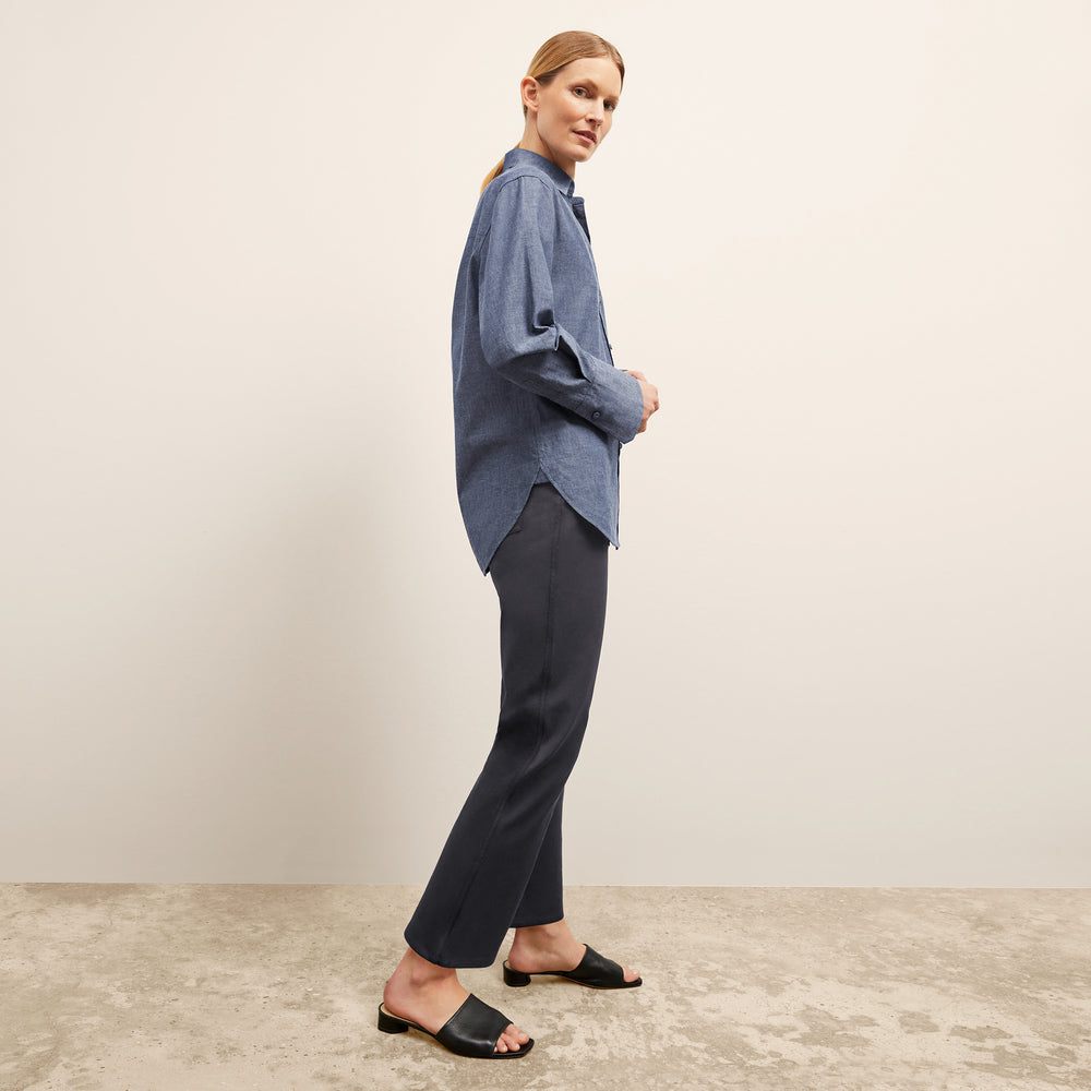 side image of a woman wearing the siobhan top in clear blue