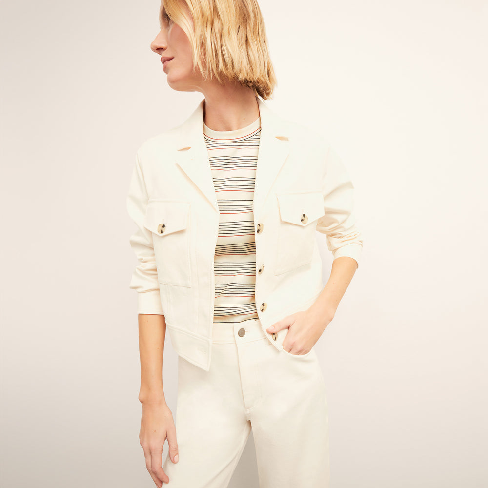 front image of a woman wearing the rhoda jacket in tusk