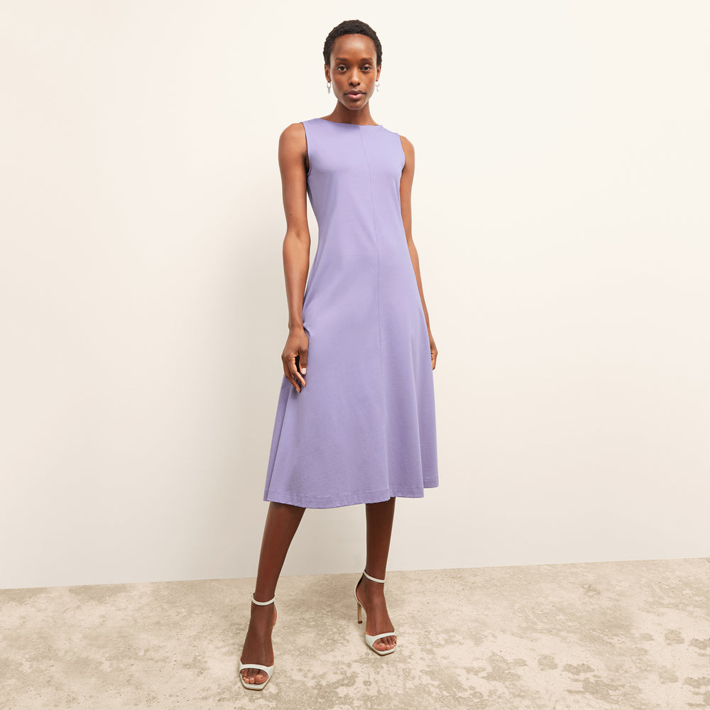 front image of a woman wearing the milano dress in light orchid
