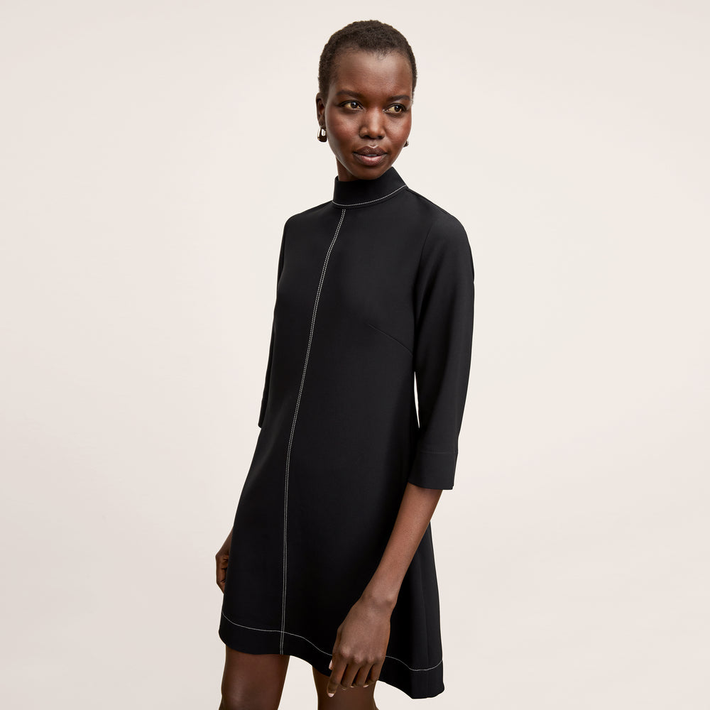 front image of a woman wearing the kinsley dress in black