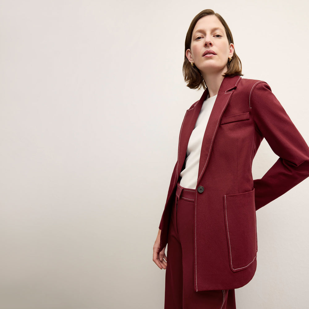 front image of a woman wearing the grenville jacket in berry jam