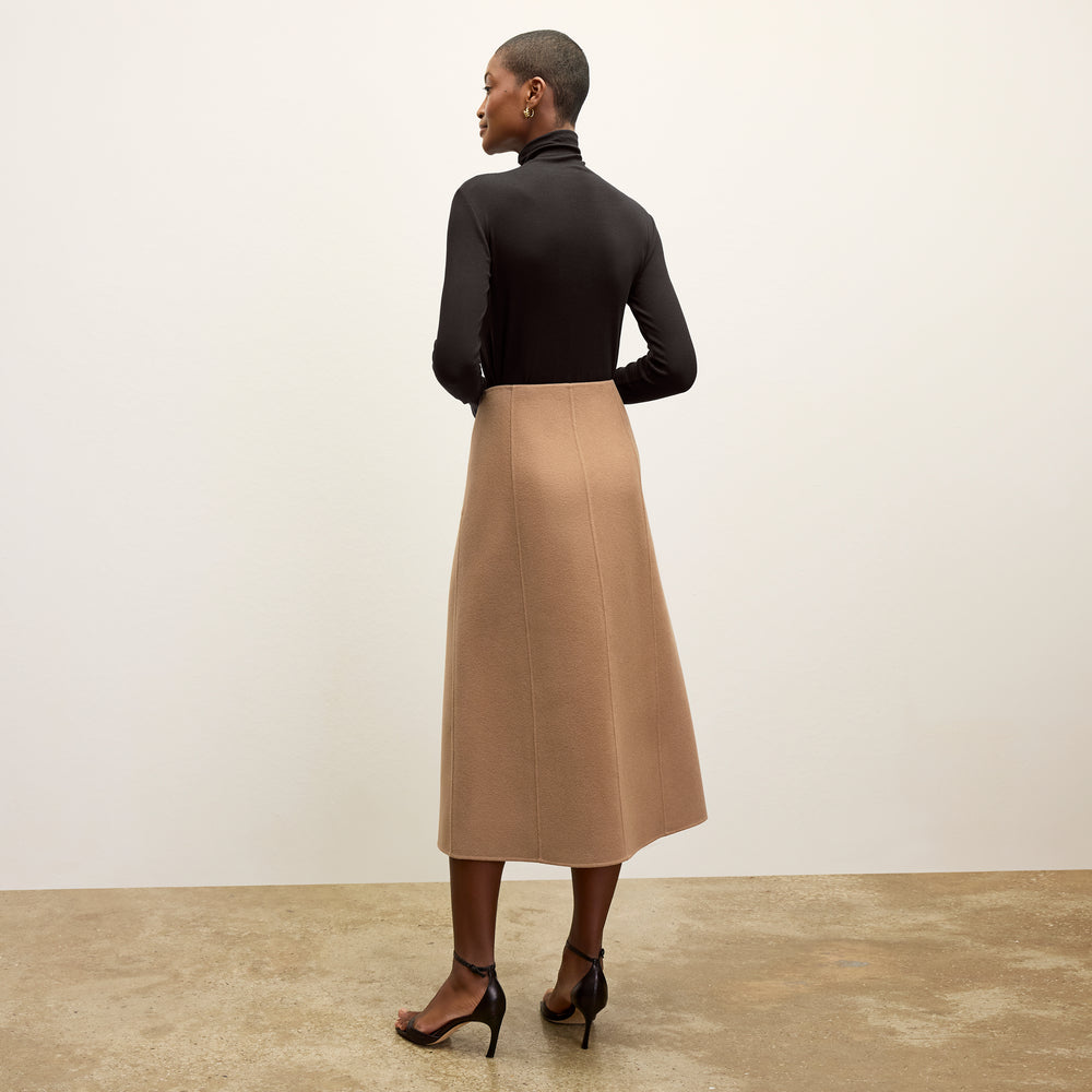 back image of a woman wearing the kerri skirt in camel