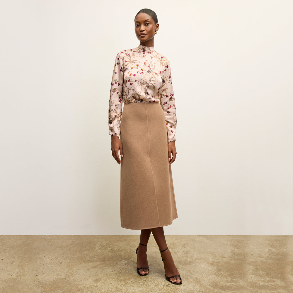 front image of a woman wearing the kerri skirt in camel