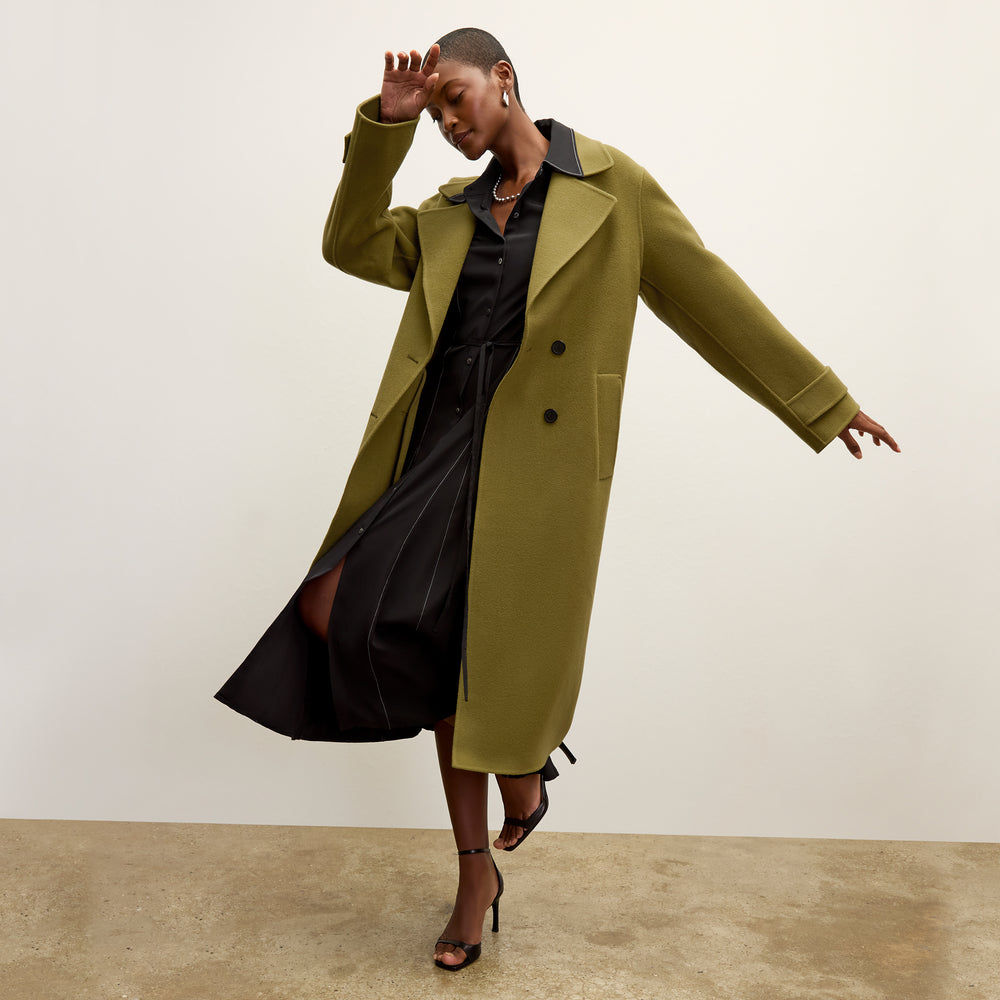 front image of a woman wearing the pepper dress in black