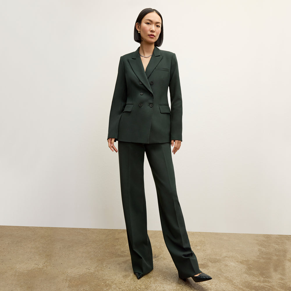 front image of a woman wearing the kati jacket in dark emerald