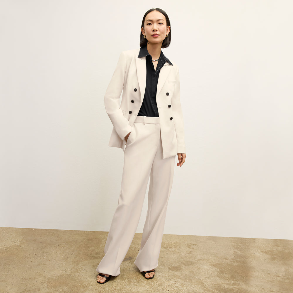 front image of a woman wearing the kati jacket in ivory