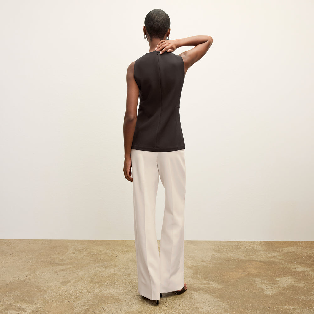 back image of a woman wearing the tinsley pant ivory