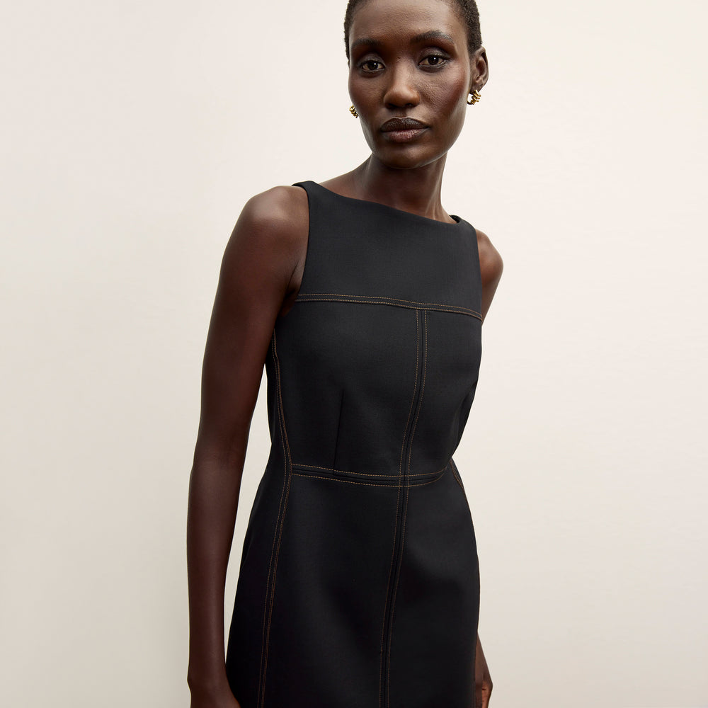 front image of a woman wearing the issa dress in black/light saddle