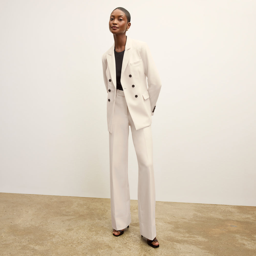 front image of a woman wearing the kati jacket in ivory