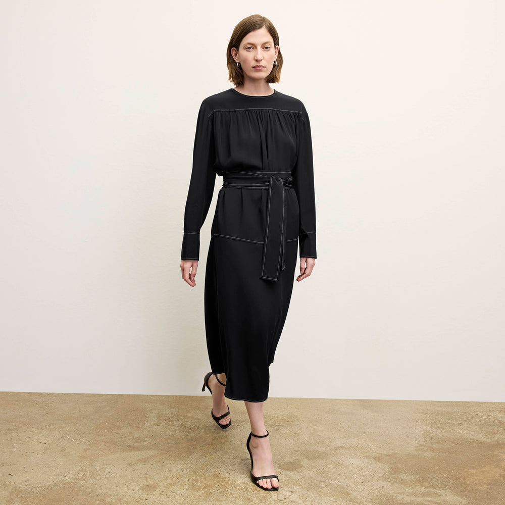 front image of a woman wearing the edie dress in black