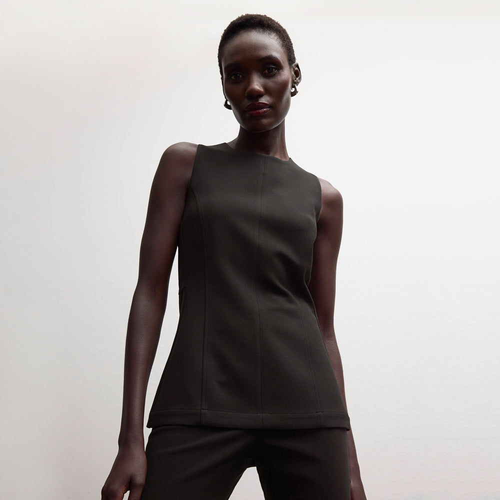 front image of a woman wearing the lucia top in black
