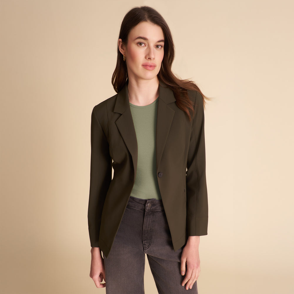 Front image of a woman wearing the Moreland jacket in olive