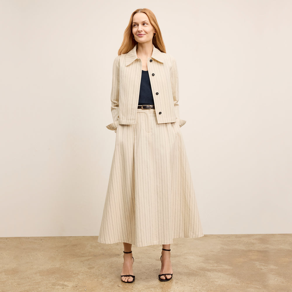 front image of a woman wearing the nicky jacket in linen stripe