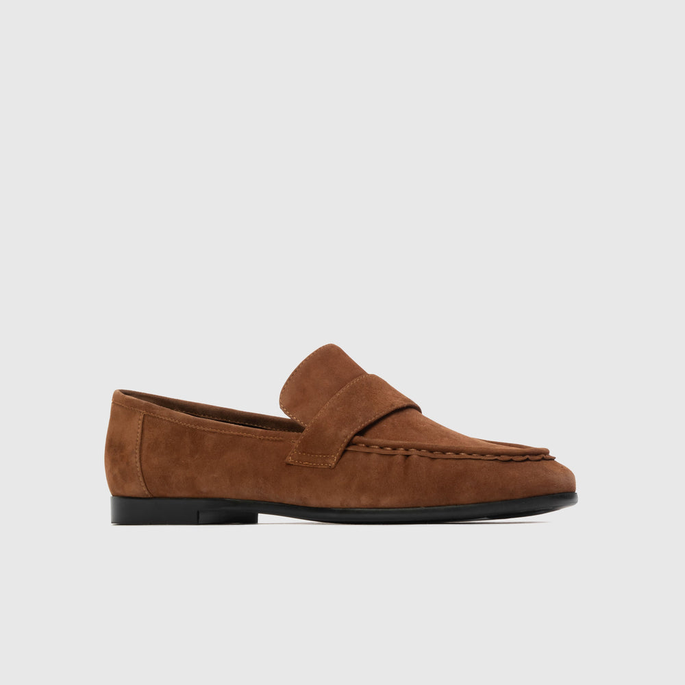 Brown suede loafer on a light gray background