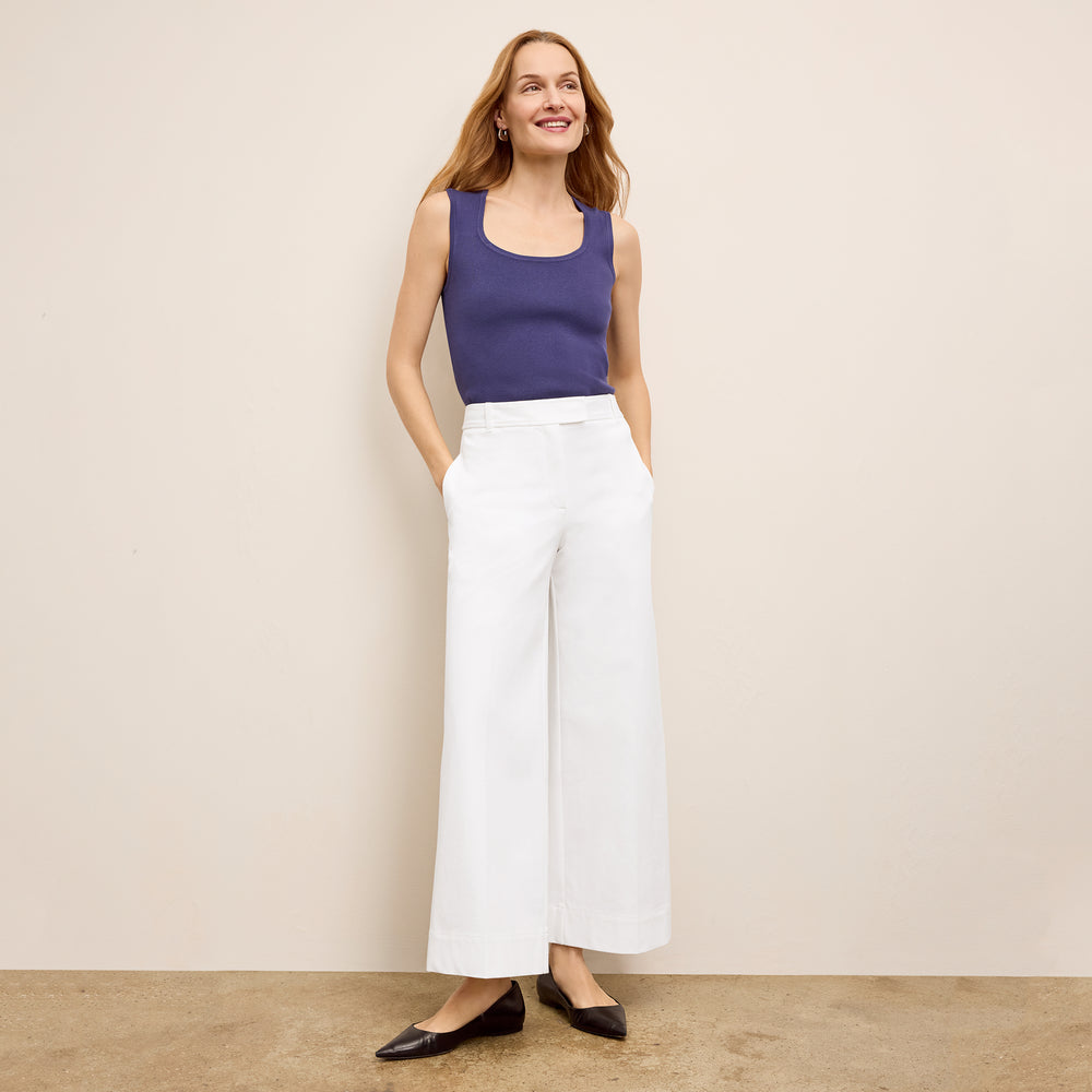 front image of a woman wearing the abby jeans in white