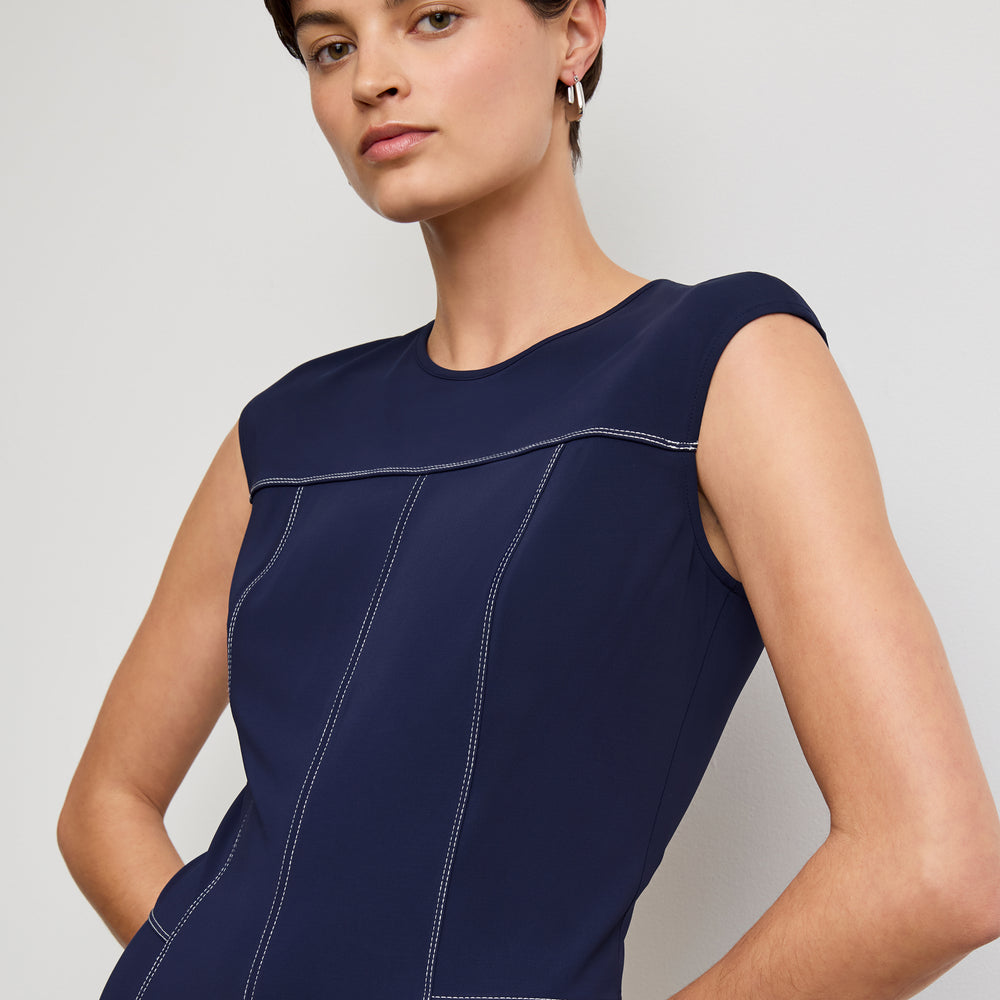 front image of a woman wearing the sylvie dress in soft navy