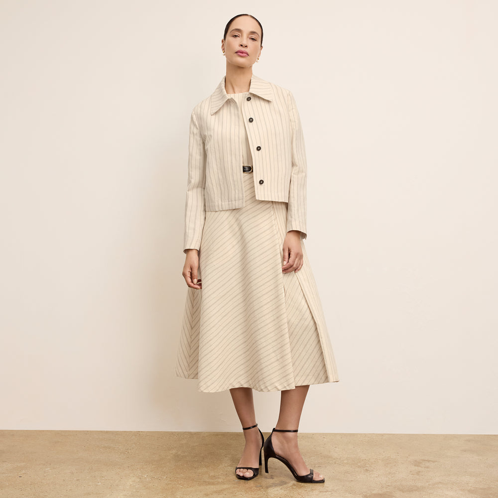 front image of a woman wearing the nicky jacket in linen stripe
