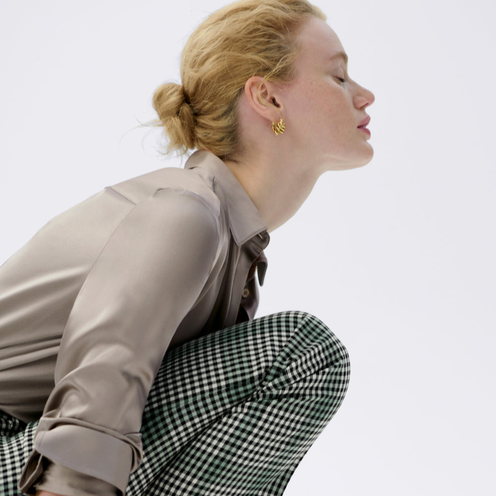 side image of a woman wearing the smith pant in check plaid