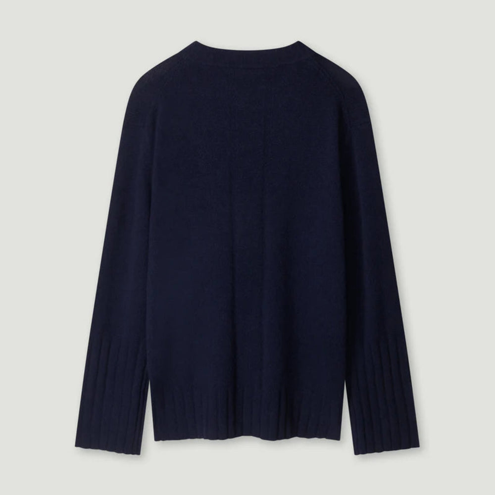 Navy sweater on a light gray background