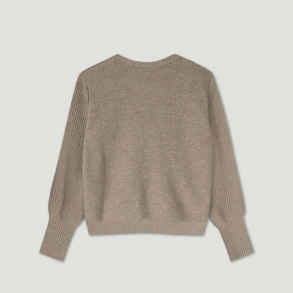 Beige sweater on a light gray background
