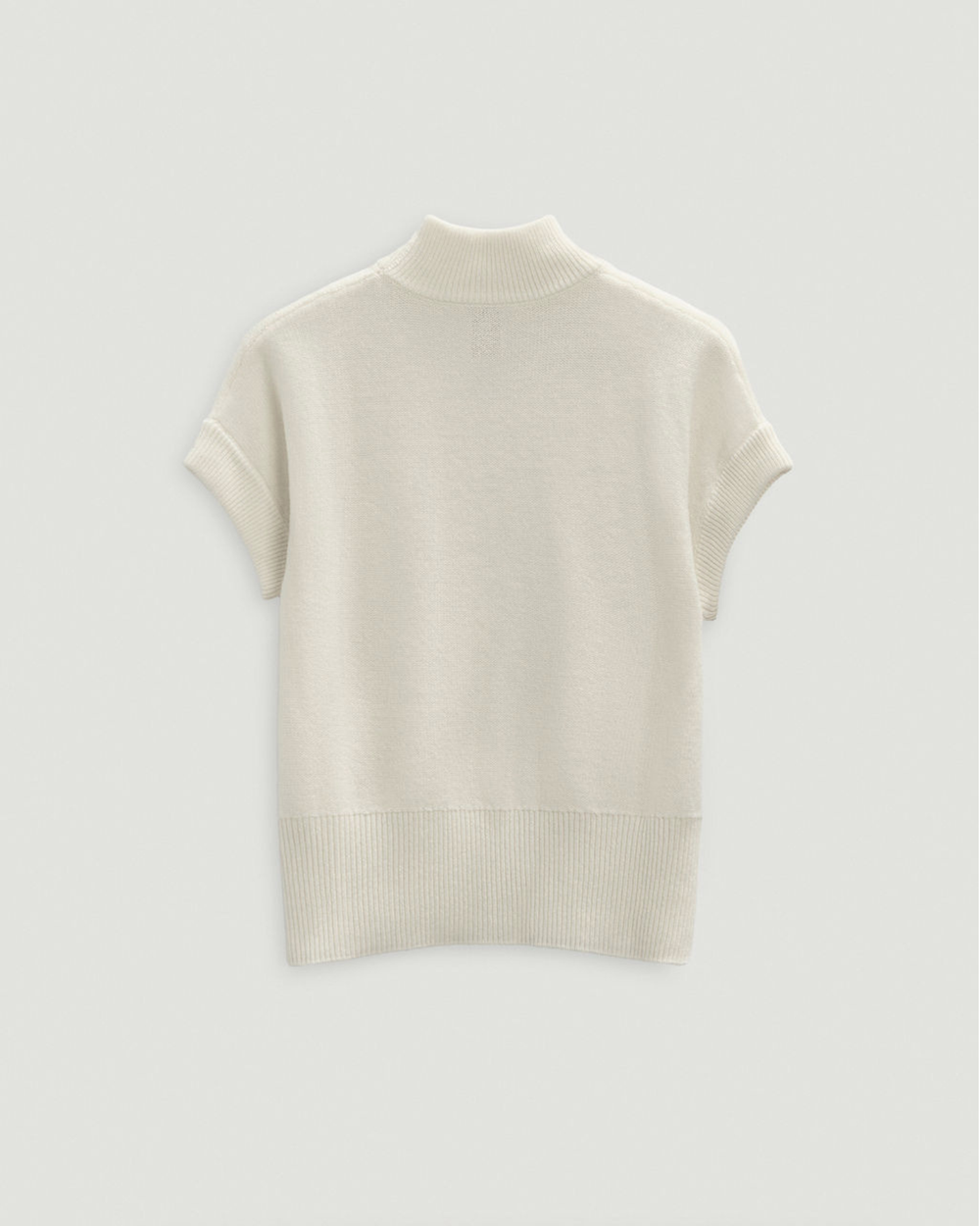 Beige t-shirt on a light gray background.