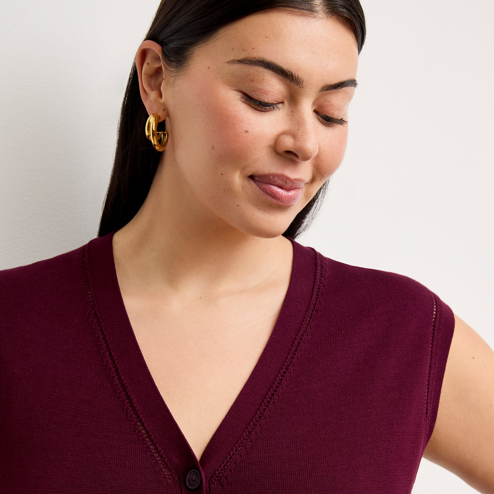 front image of a woman wearing the toula dress in syrah