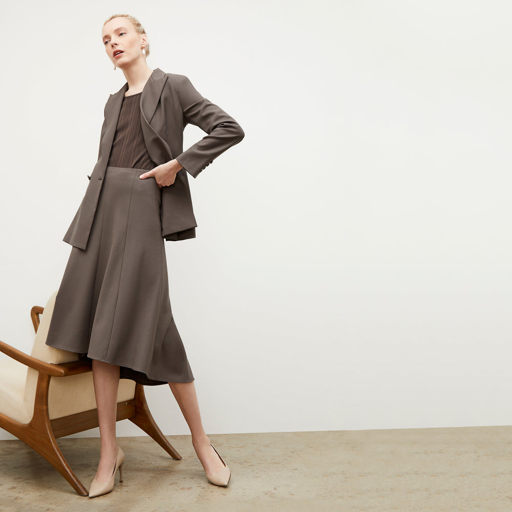 Side image of a woman wearing the Gaia Jacket - Sharkskin in Mink