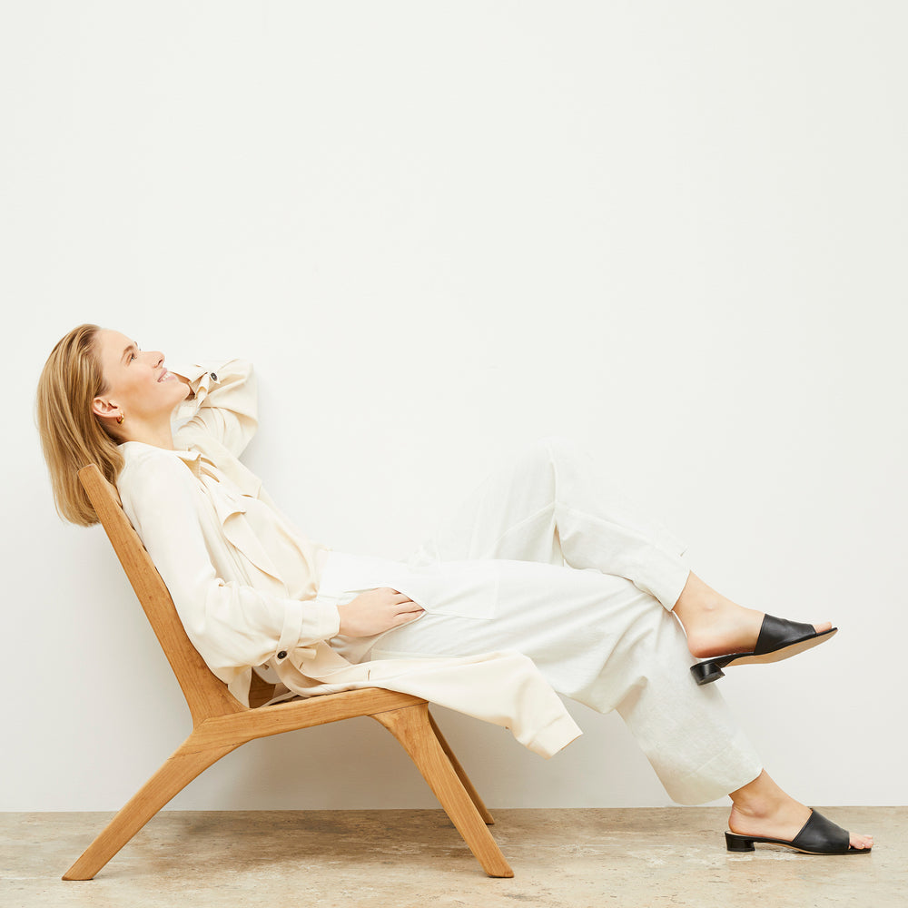 Image of a woman wearing the Madelyn Pant in Ivory