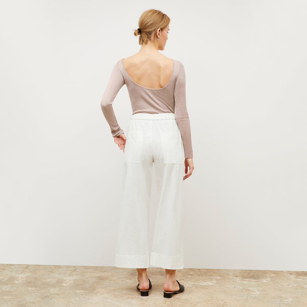 Image of a woman wearing the Madelyn Pant in Ivory
