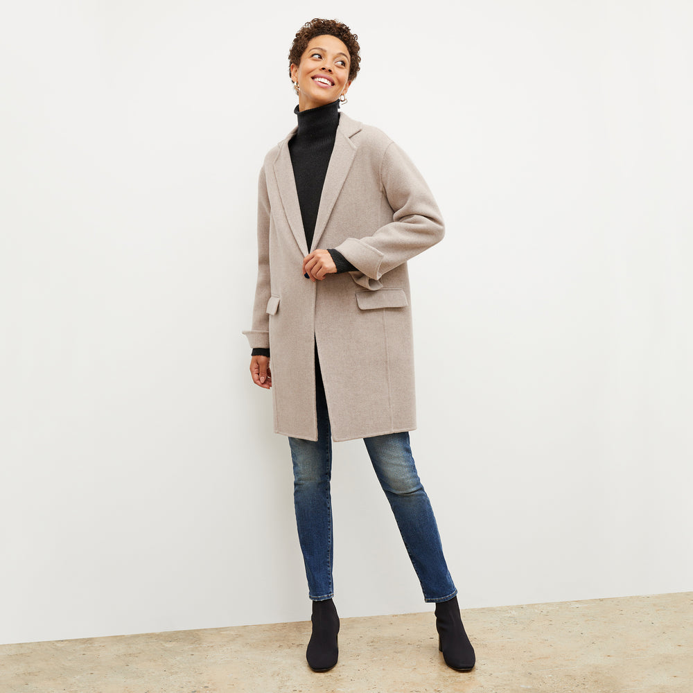 Front image of a woman wearing the kasha coat in stone melange