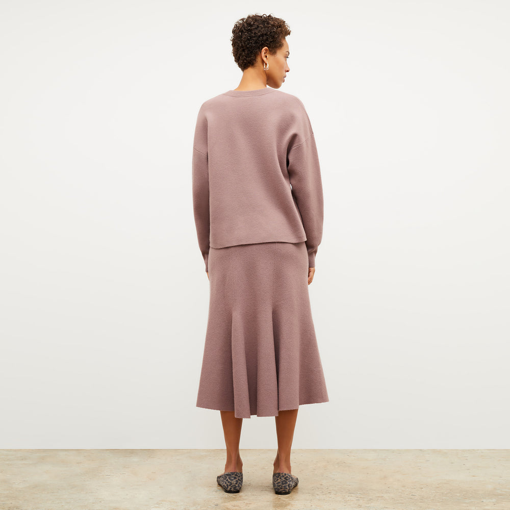 Back image of a woman wearing the quincy sweater in rose taupe