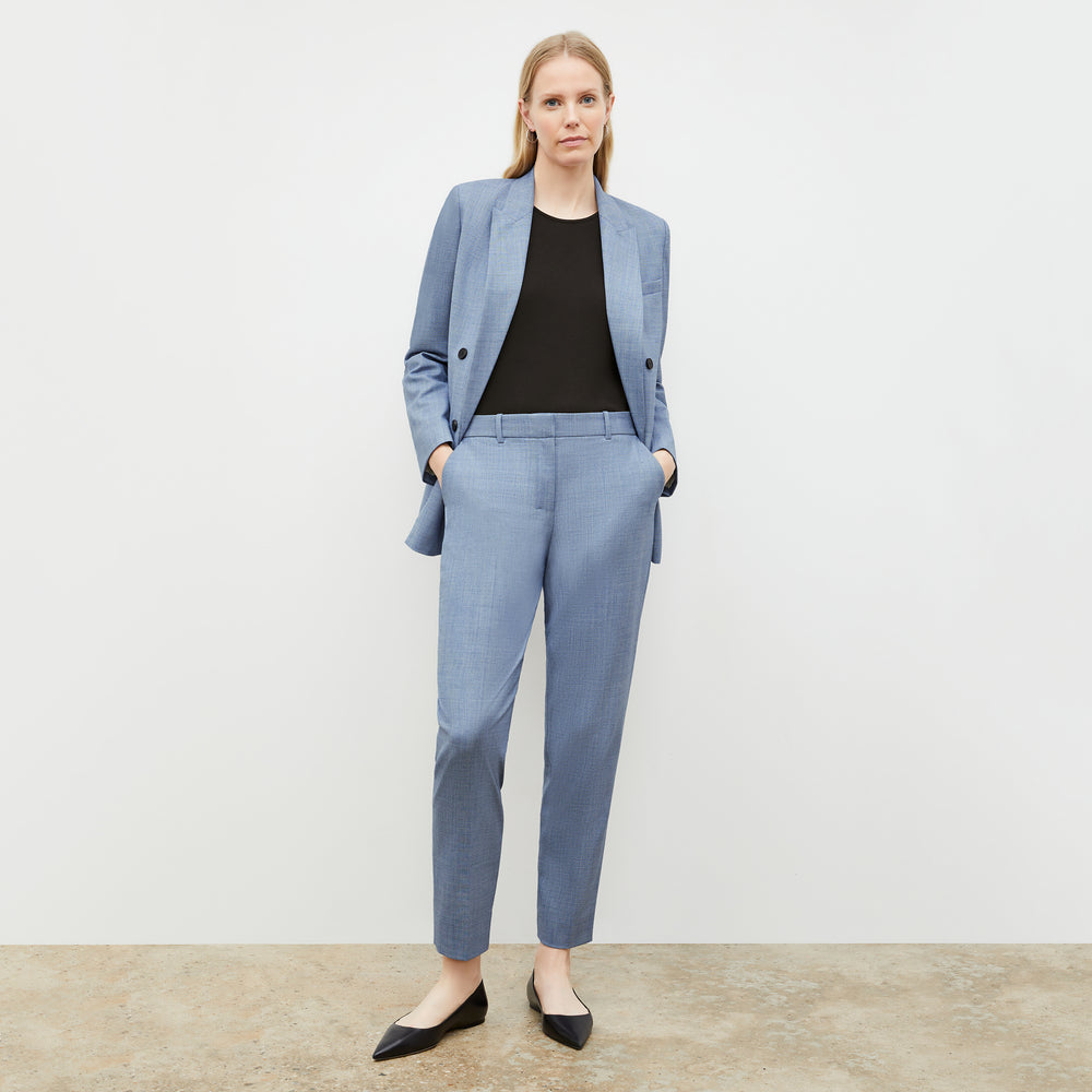 Front image of a woman wearing the mejia pant in indigo and white
